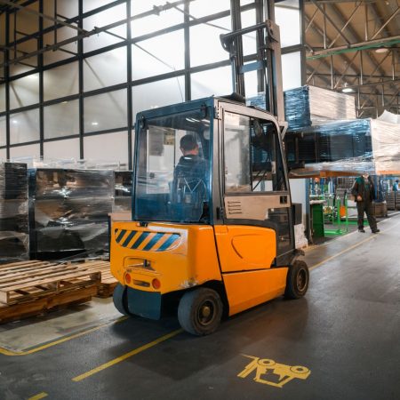 Forklift loader in storage warehouse shipyard. Distribution products. Delivery. Logistics. Transportation. Business background. High quality photo